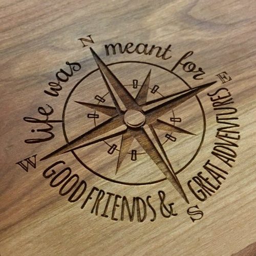 Engraved compass on a live edge charcuterie board.
