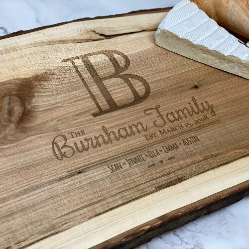 Initial design engraved on a live edge charcuterie board.