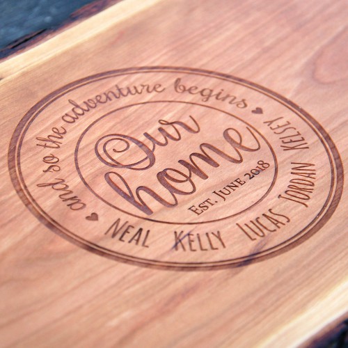 Engraved housewarming gift with our home in the center surrounded by the family members names.
