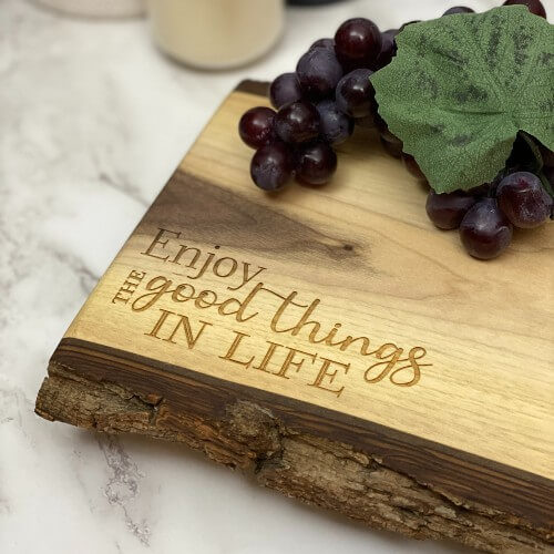 Canadian charcuterie boards engraved with "enjoy the good things in life."