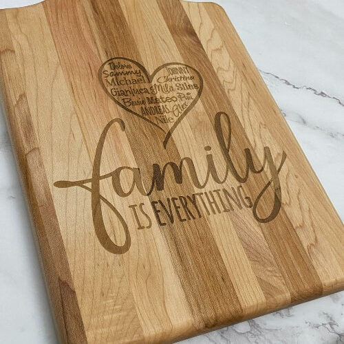 Custom engraved cutting board with all of the family members names engraved in the heart.