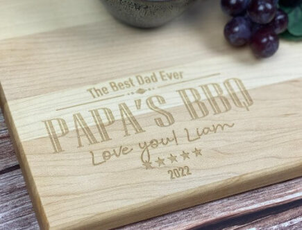 Custom cutting board with a design engraved for guys that love to BBQ!