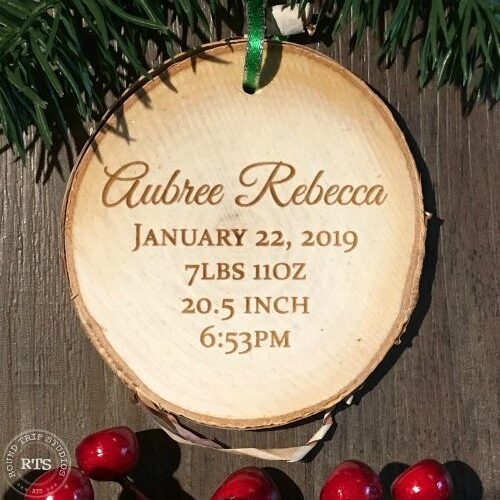 Engrave baby's name and birth statistics on a rustic birch ornament.