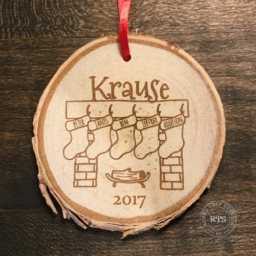 Custom stocking ornament engraved with five names.