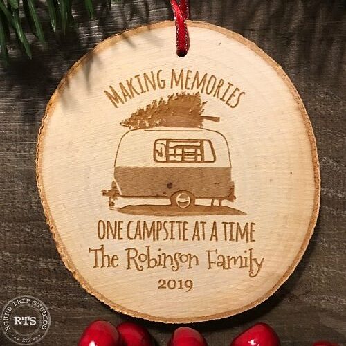 Rustic birch ornament with camper engraved and family name.