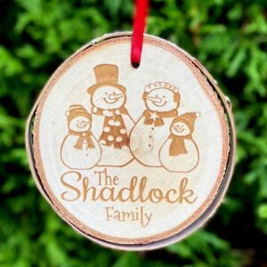 Custom Christmas ornament with a snowman family engraved.