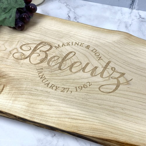 Live edge charcuterie board with newlywed's names and wedding date engraved.