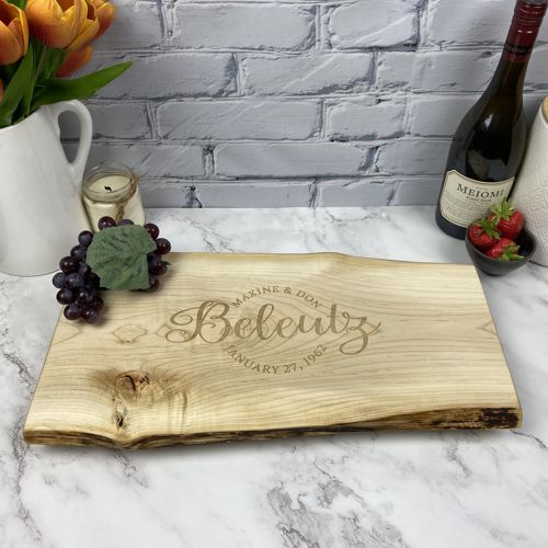 Personalized cheeseboard with the couples names and wedding date engraved.